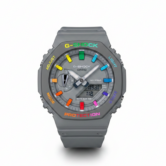 A hand-painted Casio G-Shock watch with colorful hour markers and text on the bezel, predominantly grey with rainbow-colored details.